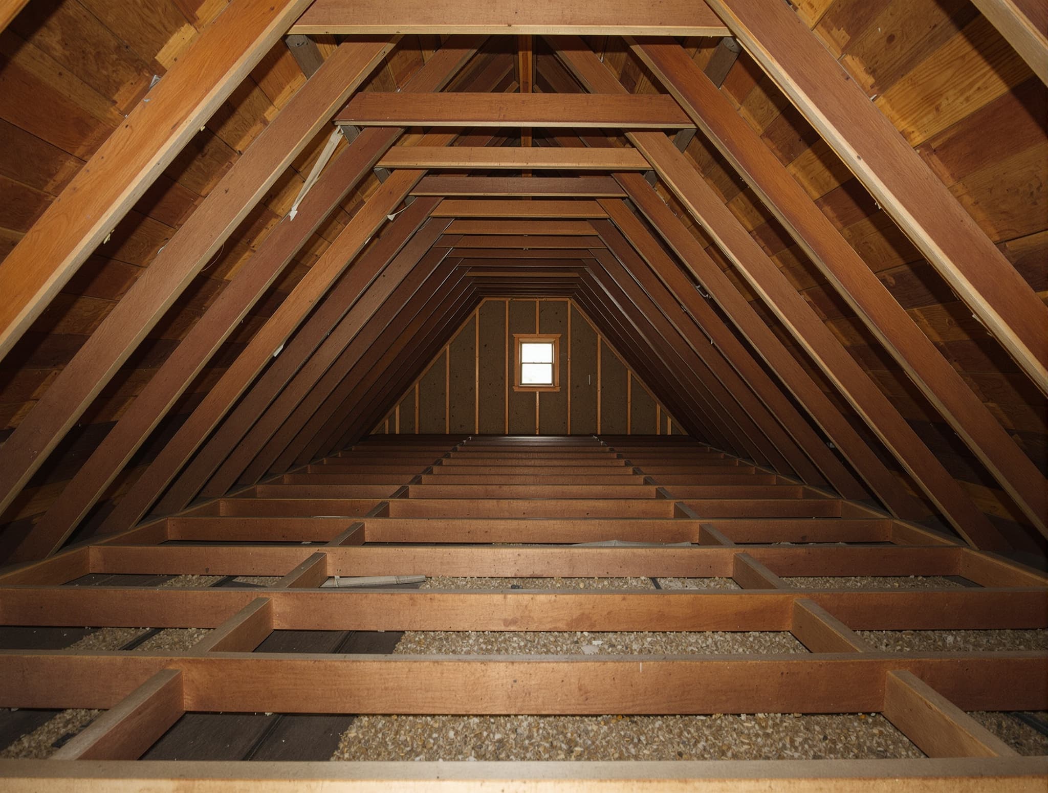 Massapequa colonial attic with bare rafters and no insulation